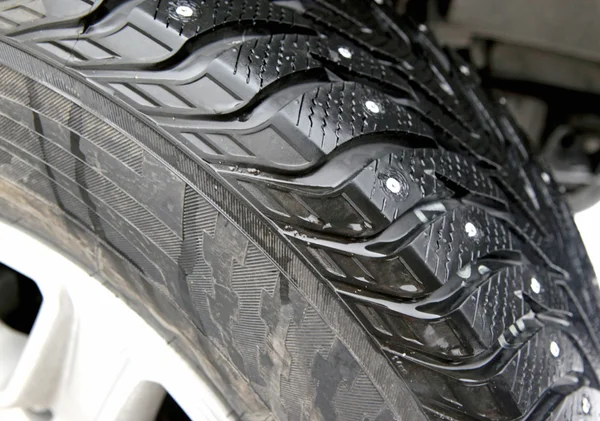 Car tire in the winter way — Stock Photo, Image