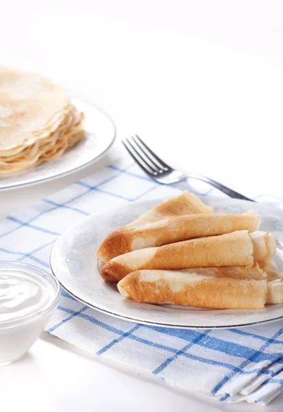 Pancakes with sour cream Royalty Free Stock Images