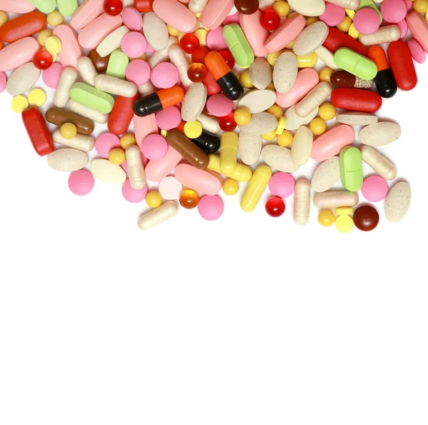 Lots of colorful tablets drug  and pills, medical background. Macro. — Stock Photo, Image