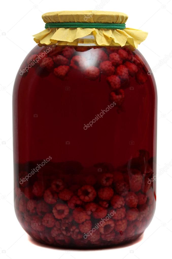 Jar with raspberry compote on  white background