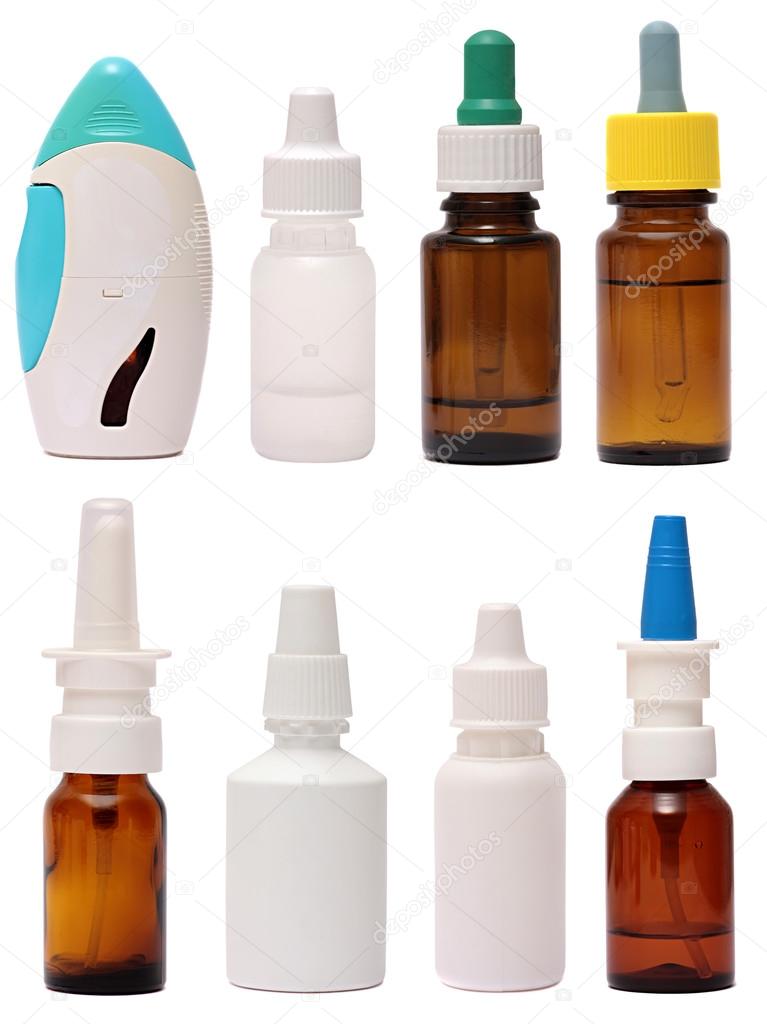 Bottles with spray nasal drops isolated on white background . Medicine for a cold
