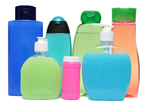 Colored plastic bottles with liquid soap and shower gel. — Stock Photo, Image