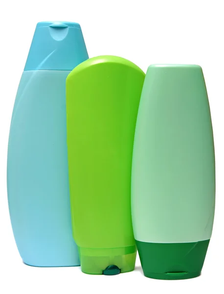 Colored plastic bottles with liquid soap and shower gel. — Stock Photo, Image