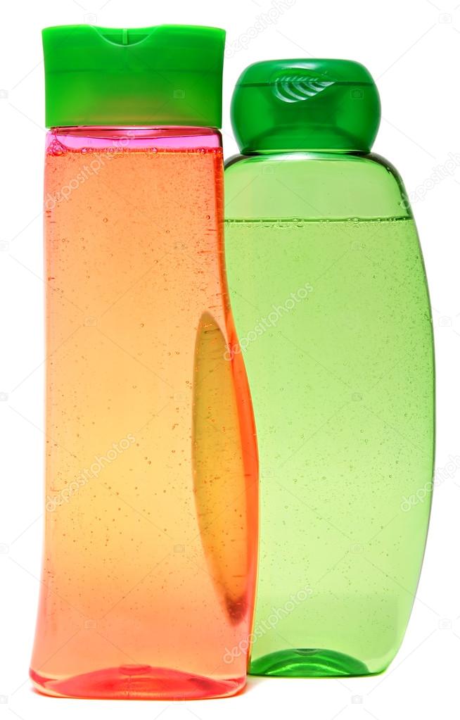 colored plastic bottles with liquid soap and shower gel.