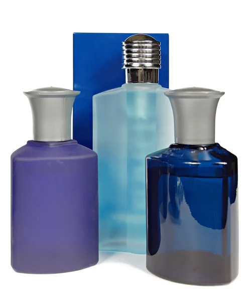 Szklane butelki perfum na białym tle. Studio fotografii. — Zdjęcie stockowe