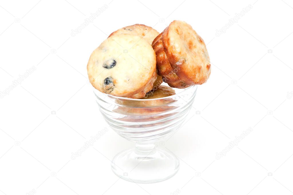 Muffins with berries in a glass bowl