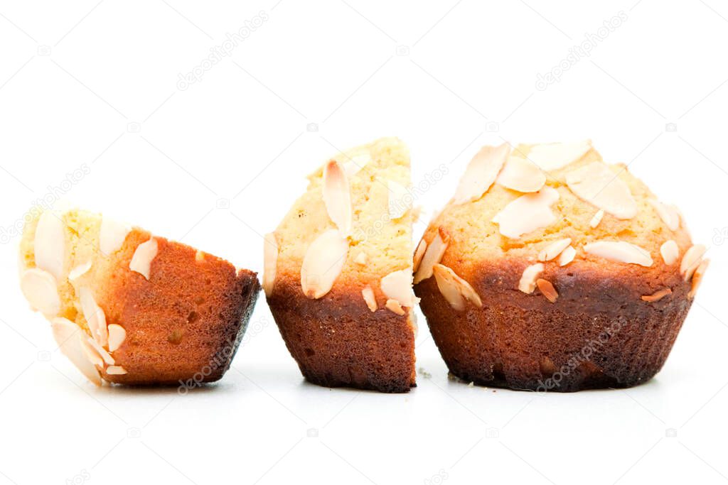Muffins with almonds isolated on a white background