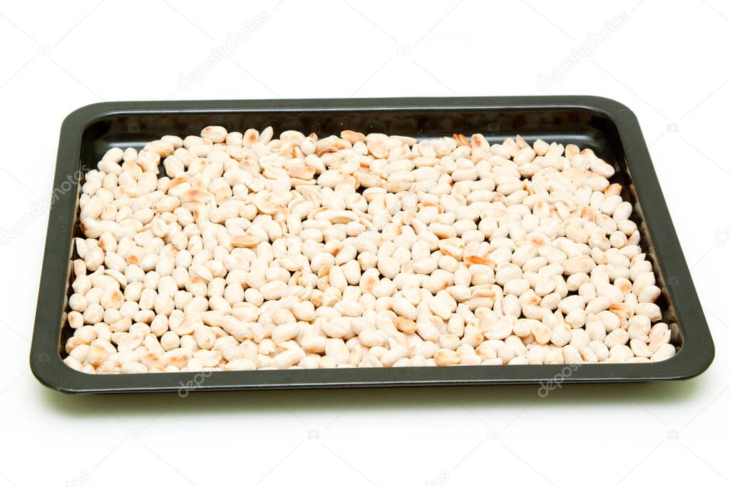 Peanuts on tray isolated on white background