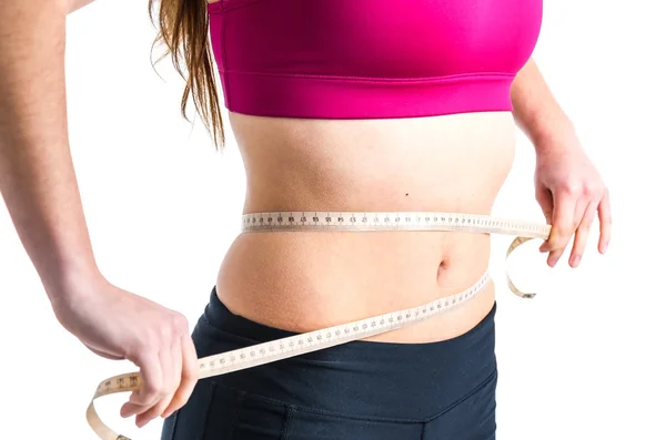 Slim girl measuring her waist — Stock Photo, Image