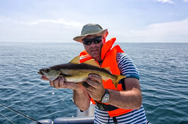 Happy angler with halibut fish — Stock Photo © peter77 #59583759