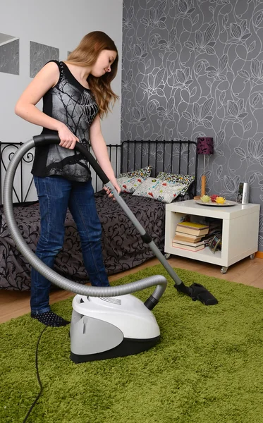 Teenager with vacum cleaner — Stock Photo, Image