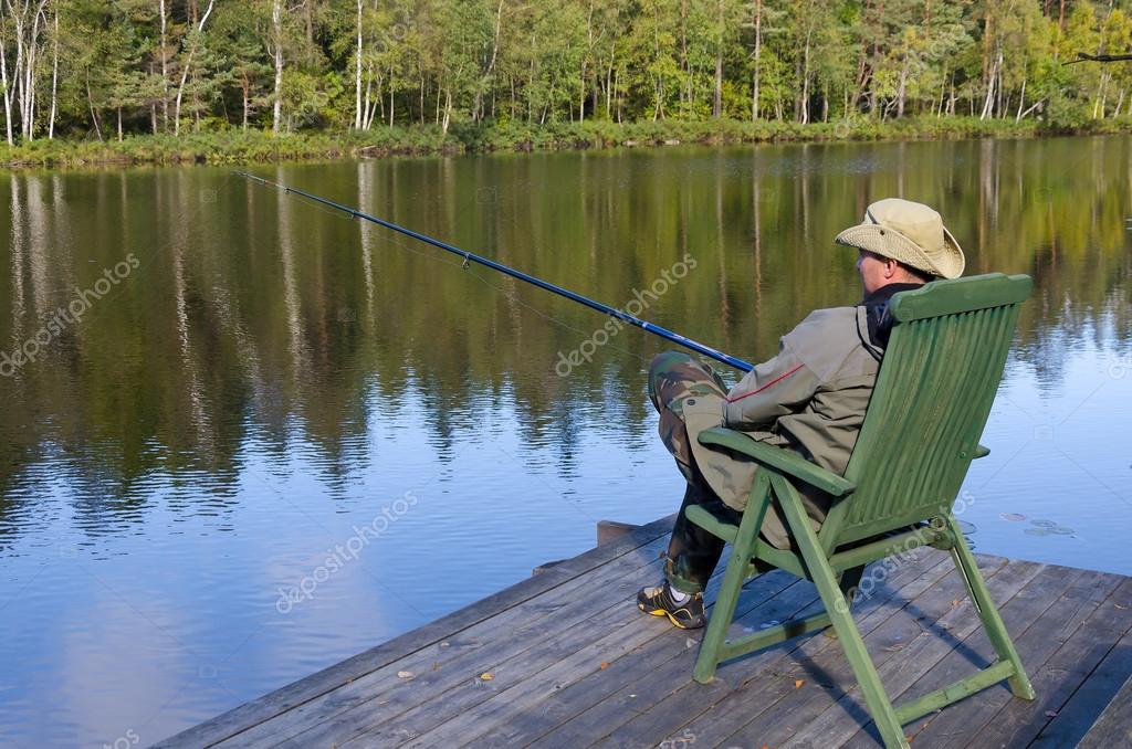 Man fishing from chair — Stock Photo © peter77 #59585703