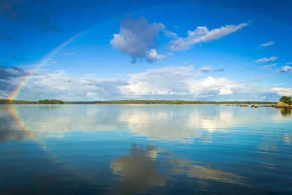 September rainbow over Swedish lake — Stock Photo, Image