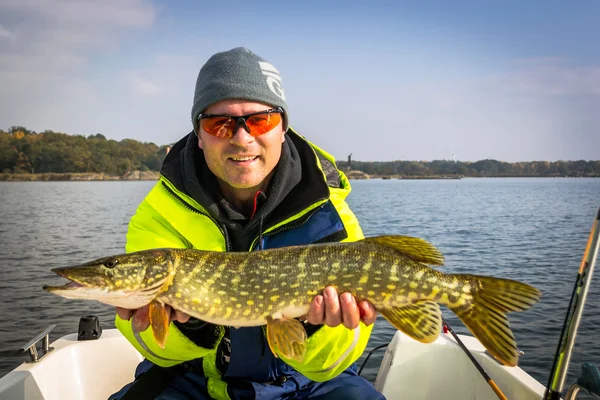Happy angler with october's pike fishing trophy — Stock Photo, Image