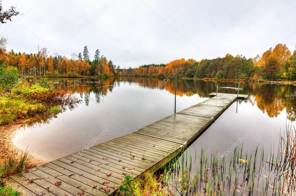 Swedish wodden bridge in autumn scenery