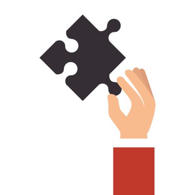 Bir yapboz parçasını tutan el.