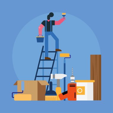 Erkek müteahhit boyanmış merdivenlerde tadilat yapıyor.