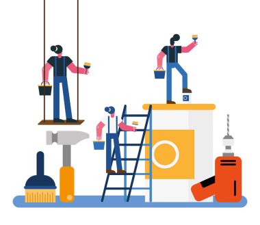 İnşaatçılar boyama ekipmanlarıyla tadilat yapıyor.