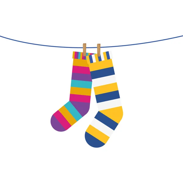 Socks pair with colors stripes hanging in wire — Stock Vector