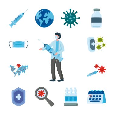 Aşı şırıngası ile tıbbi maske takan profesyonel bir doktor.