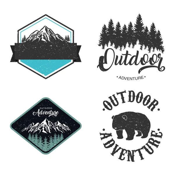 Bundle of four outdoor adventure letterings emblems with bear and mountains — Stock Vector