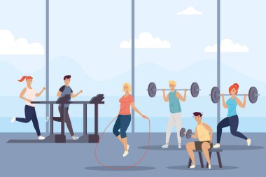 Spor salonunda spor yapan bir grup insan.