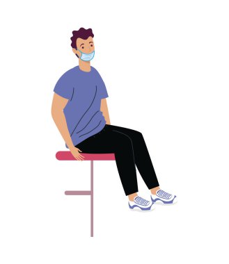 Tıbbi maske takan adam.