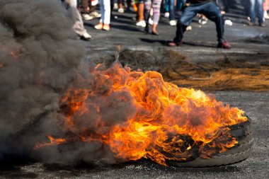 Protest Action with Burning Tyres clipart