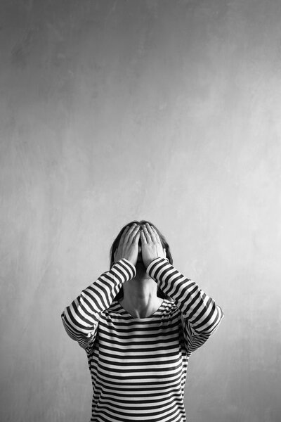 Vertical image of a frustrated woman