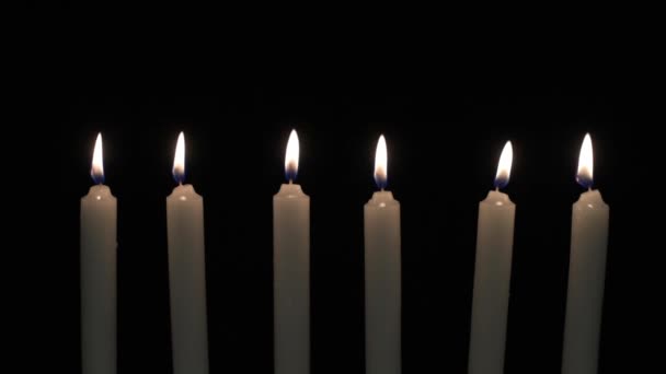 Six candles in a row — Stock Video