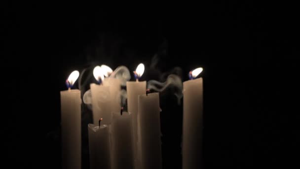 Candles blow out in the darkness — Stock Video