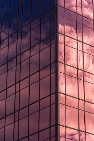 Reflected in windows of office building — Stock Photo, Image