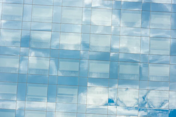 Blue sky and clouds reflected — Stock Photo, Image