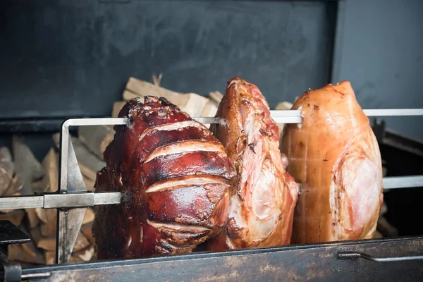 Roasted pig knuckle on the spit — Stock Photo, Image