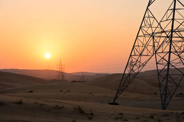 Power line in dunes in Liwa — Stock Photo, Image