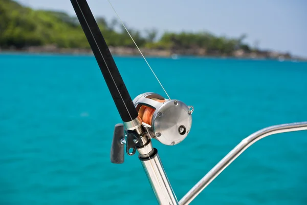 Fishing rod and reel on a boat — Stock Photo, Image