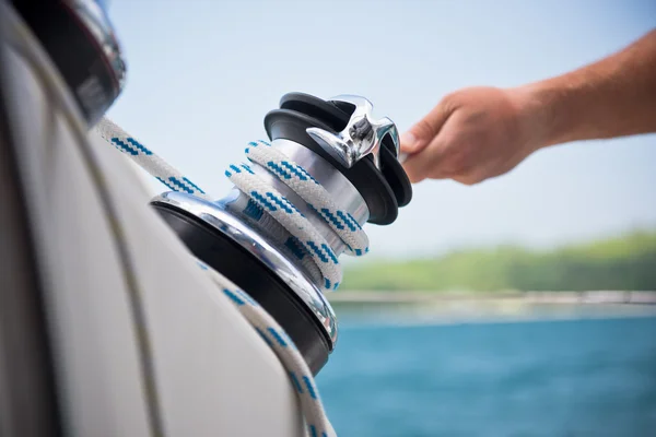 Winch and sailors hand — Stock Photo, Image