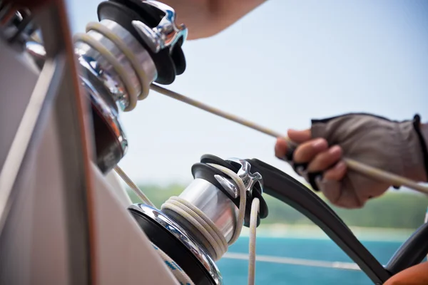 Winch and sailors hands — Stock Photo, Image