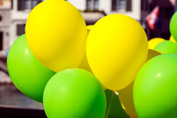 Bright yellow and green balloons — Stock Photo, Image