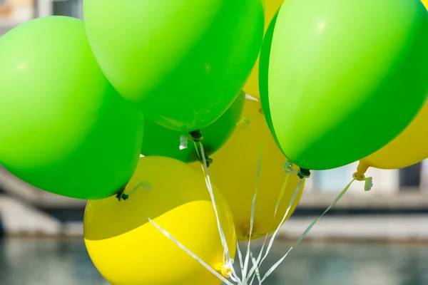 Bright yellow and green balloons