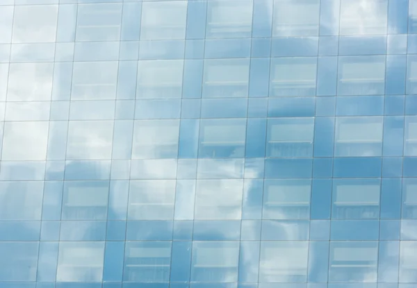 Blue sky and clouds reflected — Stock Photo, Image