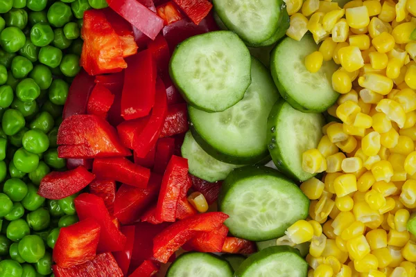 Färska välsmakande blandade grönsaker bakgrund — Stockfoto