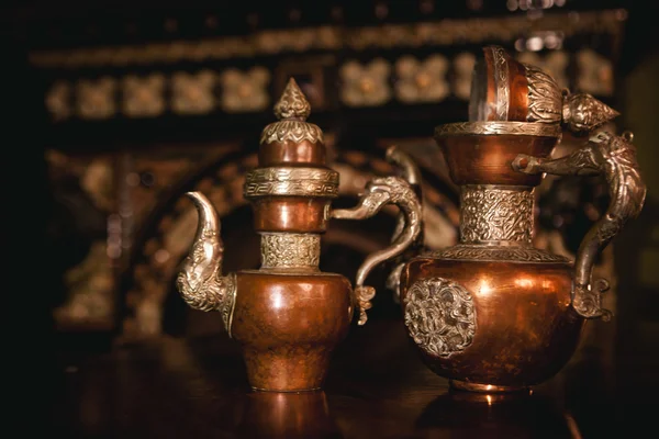 Vintage still life with antique teapots  and  bottles with tea and grass in bottles — Stock Photo, Image