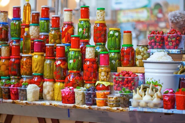 Preserved vegetables in glass jars — Stock Photo, Image