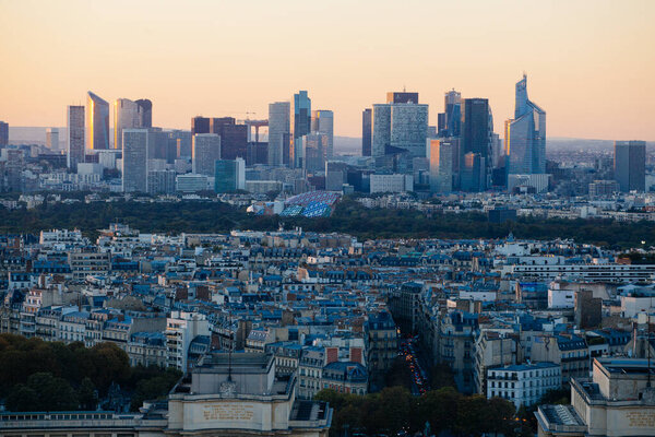 Paris, France - October 5, 2015: Sunset view from Eiffel tower to la Defence area in Paris as seen on 5 of October, 2016
