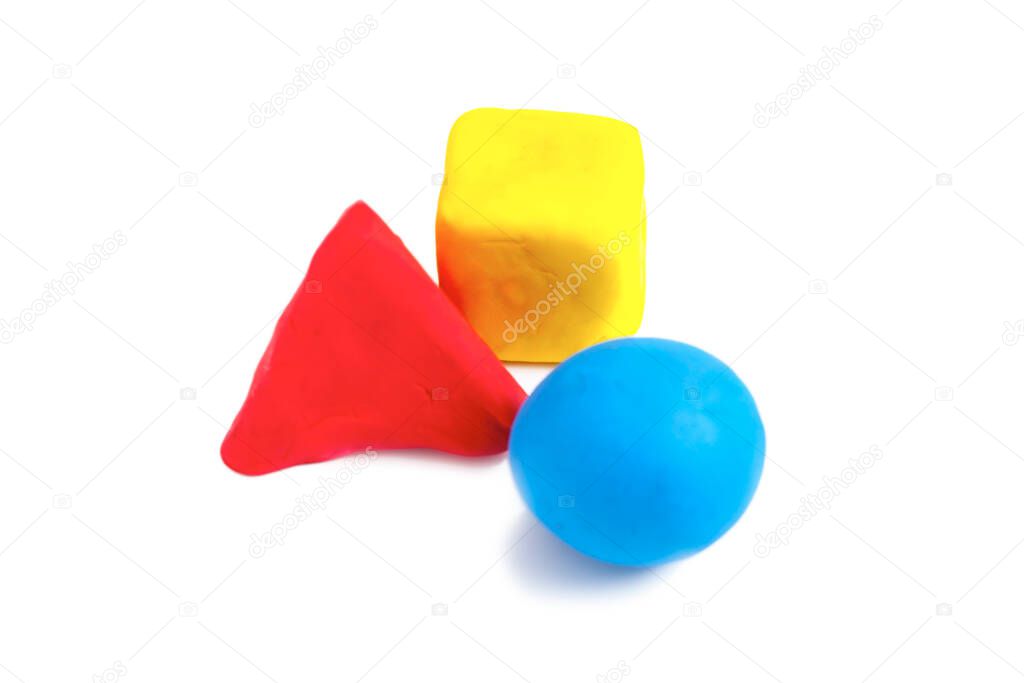Pyramids, cubes and balls made with colorful plasticine,  on the white background