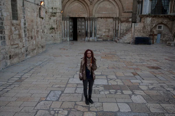 Young woman near Church of the Holy Sepulchre in Old City of Jerusalem