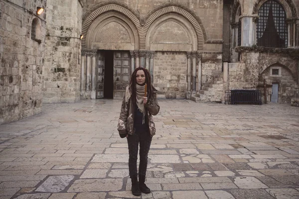 Young woman near Church of the Holy Sepulchre in Old City of Jerusalem