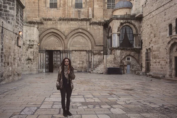 Young woman near Church of the Holy Sepulchre in Old City of Jerusalem