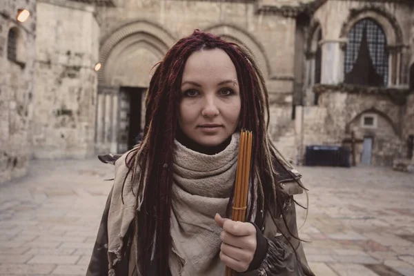 Young woman near Church of the Holy Sepulchre in Old City of Jerusalem